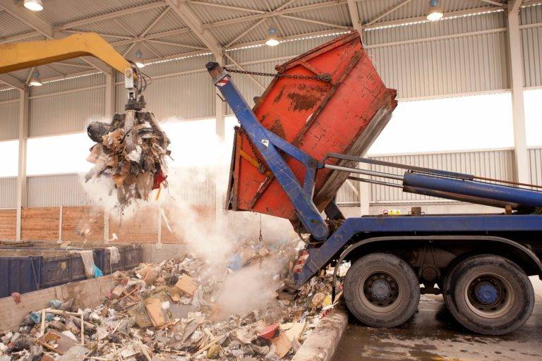 a skip hire lorry tipping waste